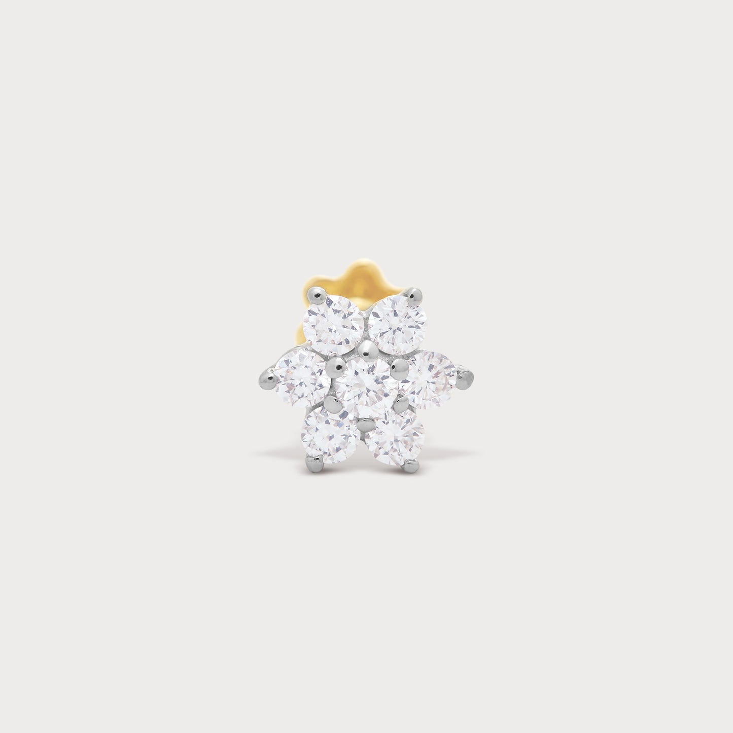 The Flora diamond nose pin, a floral design featuring brilliant round diamonds set in gold. Elegant diamond jewellery for women.