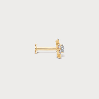 The Frostflake Nose Pin: Gold nose pin with sparkling diamonds set in a delicate frostflake design, a piece of fine diamond jewellery.
