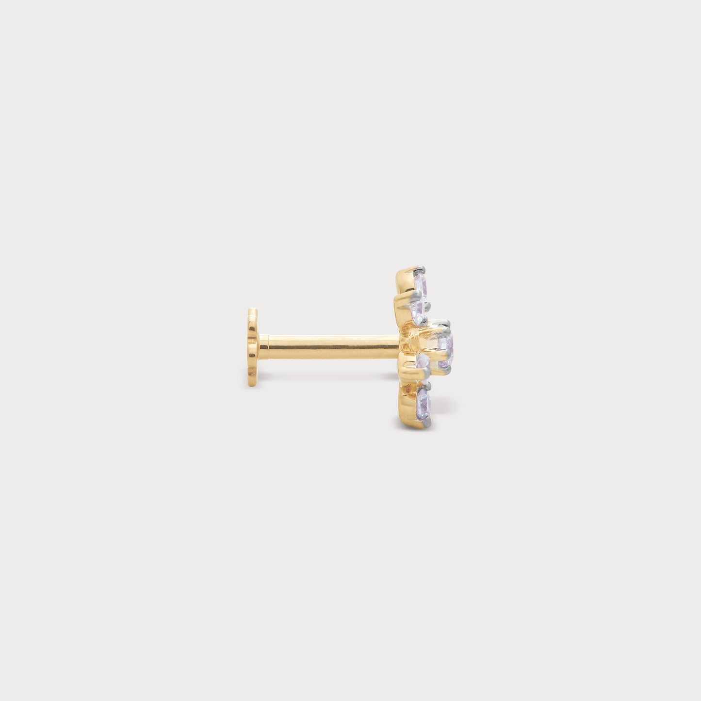 The Stellar Cluster Nose Pin in gold with multiple sparkling diamonds, ideal for elegant nose piercings. Fine diamond jewelry.