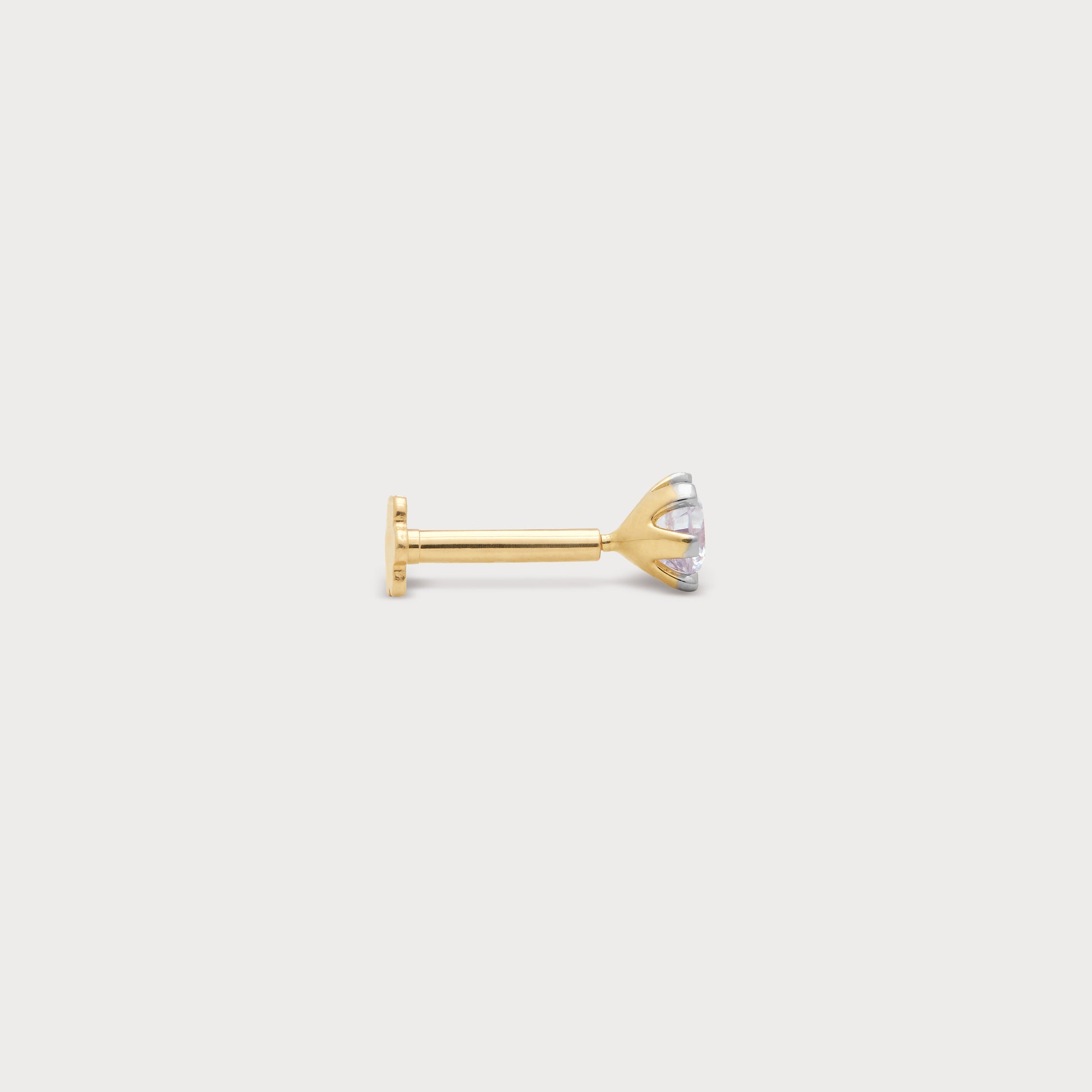 Elegant gold stud nose pin featuring a sparkling diamond, perfect for diamond jewelry collections and everyday wear.