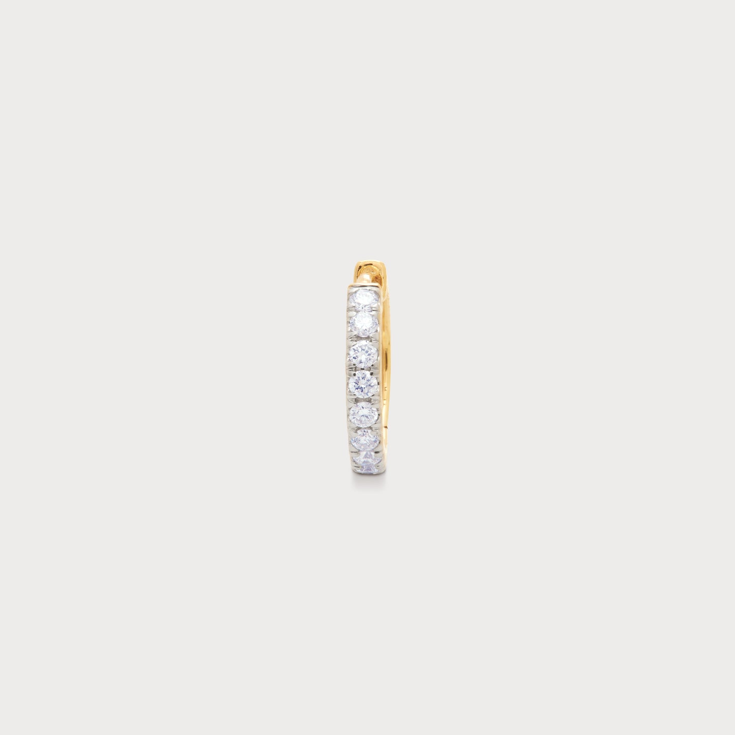 The Eternity Loop diamond nose pin in yellow gold, featuring a continuous row of brilliant round diamonds. Perfect for elegant diamond nose jewelry and piercings.