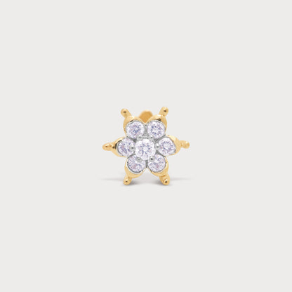 Sparkling gold floral diamond stud earring or nose pin with brilliant round diamonds.