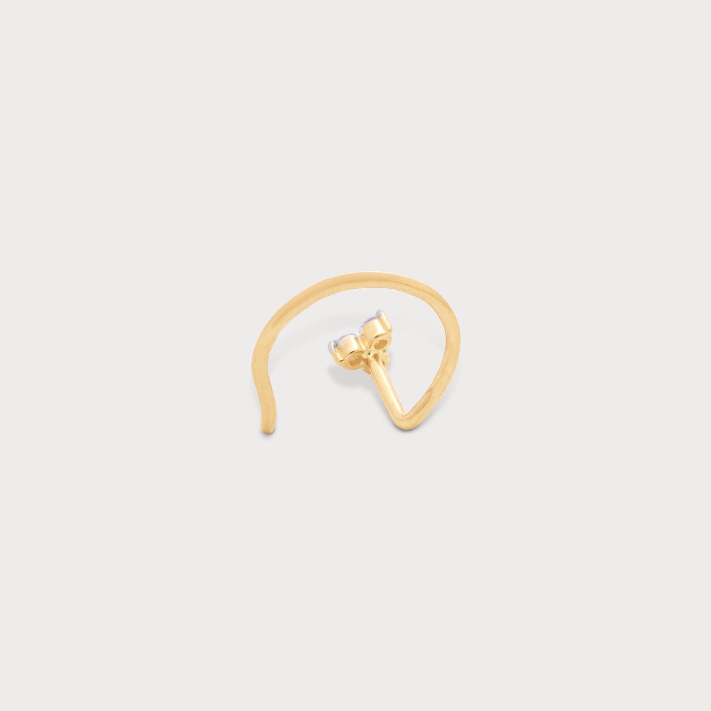The Trio Spark Nose Pin: Elegant gold nose pin with three brilliant diamonds. Perfect for women seeking dazzling diamond jewelry online.